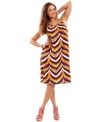 Dance to the samba beats with INC's sleeveless plus size dress, featuring an electrifying print!