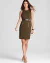 Master utilitarian chic in this belted MICHAEL Michael Kors Petites sheath dress, finished with front zips for modern edge. Amp up the sleek silhouette with nude heels.