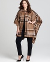 Drape yourself in this luxurious plaid blanket coat from MICHAEL Michael Kors Plus, perfect with tall leather boots and a cozy sweater.