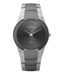 Exquisitely contemporary, this watch by Skagen Denmark is a modern masterpiece. Stainless steel bracelet with black plating at center links and round case with four lugs at bezel. Brushed charcoal dial features two silver tone hands and logo. Quartz movement. Water resistant to 30 meters. Limited lifetime warranty.