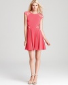 In a vibrant, rosy hue, this ERIN Erin Fetherston dress gets cheeky with lace cutouts.