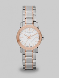 In a subtle reference to those beloved Burberry checks, this elegant stainless steel timepiece has a patterned face and warm rose goldplated accents.Quartz movementWater resistant to 5 ATMStainless steel round case with IP rose goldplated accents, 26mm diameter (1)Polished bezelSapphire crystalCheck-pattern white dialRose goldplated bar hour markersSecond handTwo-tone link bracelet with fold over buckleMade in Switzerland