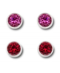 Bright idea: Add a playful pop of color to your look with Swarovski's stylish set of vibrant crystal stud earrings. Featuring colored crystals in fuchsia and red, they're set in silver tone mixed metal. Approximate diameter: 2/10 inch.