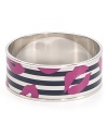 Make a statement with this MARC BY MARC JACOBS bangle. The classic black and white stripe pattern is interrupted with a bold lip print, making it unmistakably Marc.