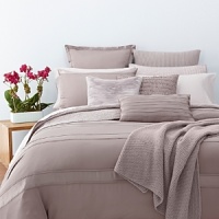 Alternating bands of luxurious matte and shiny silk, trimmed in airy chiffon elevate a simple bedding ensemble. Sheets, pillowcases and bedskirt are simple, soft 410-thread count Egyptian cotton.