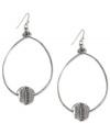 Well-rounded fashion from Jessica Simpson. These oval hoop earrings showcase round crystal accents. Crafted in antiqued worn silver tone mixed metal. Approximate drop: 2-1/2 inches.