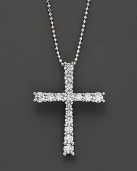 White gold graduated diamond cross pendant with ball chain.