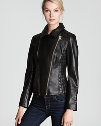 Flaunt fashion-forward style in this supple Via Spiga leather jacket designed with asymmetric accents, side quilting and exposed zip detail. Downtown cool for fall, it's the day-to-night layer of the season.