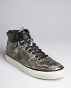 High gloss contrasts with distressed metallic nylon on these futuristic sneaks from Diesel, which have just the right amount of downtown attitude for your killer weekend plans.