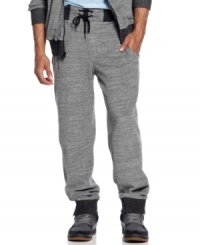 Sean John track pants with the kind of luxe detailing-contrast ribbing, slanted pocket openings, zipper closures-that make them simply extraordinary.