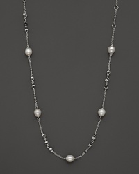 This sterling silver necklace, gleaming with freshwater pearls, makes an elegant statement. By Di MODOLO.