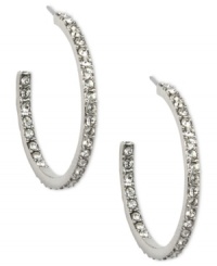 Cover every angle in sparkle. Givenchy's elegant hoop earrings flaunt an inside out design crystallized with Swarovski elements. Crafted in imitation rhodium plated mixed metal. Approximate diameter: 1-1/8 inches.