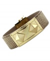 Stand out from the crowd. Pyramid studs bring a fashionable edge to this magnetic snap bracelet from Vince Camuto. Crafted from gold-tone mixed metal. Approximate length: 8 inches.