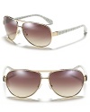 The classic aviator gets a stylish update with striated arms from MARC BY MARC JACOBS.