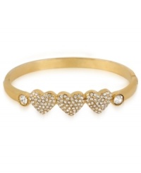 Your heart will go aflutter for this hinge bangle bracelet from Betsey Johnson. A triple heart design is prettied up with crystal accents. Includes signature gift box (4 diameter). Crafted in antique gold tone mixed metal. Approximate diameter: 2-1/3 inches.