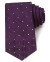 Crafted in luxurious silk with a reserved pattern for classic appeal, this plush tie makes a polished statement.