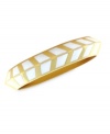 A bold direction. Vince Camuto's bangle bracelet is crafted from gold-tone mixed metal with ivory enamel making up a stylish chevron pattern for added appeal. Approximate length: 8-1/2 inches.