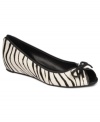 Flounce about in your pretty shoes. The Model flats by Franco Sarto feature a pretty peep-toe and a cute bow at the top.