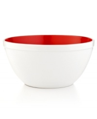 Pop goes the color. A bright red interior pokes its head out of this clean & crisp enamel bowl, adding the perfect punch of lively color to your countertop. Heading straight from prep to presentation, this durable bowl lets you stir, mix and make, all in one place.