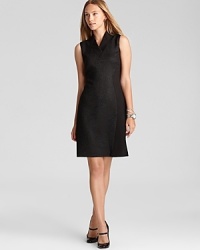 Exotics go executive as reptilian embellishment lends textural interest to a classic T Tahari sheath dress. Tame the style with classic pumps and sleek accents.