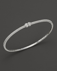 Two white sapphire hearts meet on this slim sterling silver bangle.