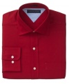 Saturate your style. In a rich hue, this Tommy Hilfiger shirt ups the ante on your dress wardrobe.