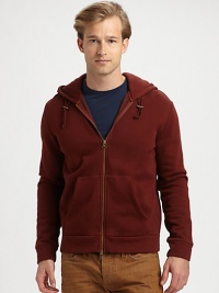 A casual-wear staple is deep dyed to a cool brick hue for instant everyday style.Two-way zip frontAttached drawstring hoodFront kangaroo pocketsCottonMachine washImportedOUR FIT MODEL RECOMMENDS ordering true size. 