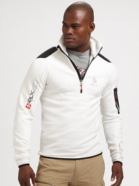 Constructed in a breathable stretch fleece, a half-zip mockneck jacket makes a sporty statement with woven patches and printed logo graphics.Half-zip frontStand collarZippered pocket at sleeve53% polyester/38% nylon/9% elastaneMachine washImported