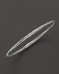 From the Silver Collection, a bold sterling silver hammered bangle. Designed by Ippolita.