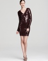 Attention must be paid to this shimmering Robert Rodriguez mini dress saturated in sequins with a beguiling V neckline.