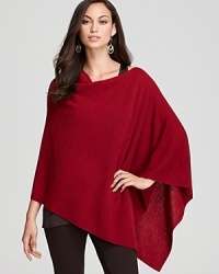 Embrace a bohemian sense of style in an effortless Eileen Fisher poncho rendered in luxe merino wool.