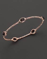 From the Rosé collection, five smoky quartz stations on a hammered bangle. Designed by Ippolita.