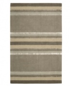 Linear designs are accented with exotic faux silk to create a timeless palette in the Sahara area rug from Calvin Klein. Crafted by skilled artisans in India, it features generously thick wool and viscose fibers woven to create remarkable strength and impeccable elegance.