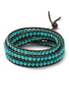 Chan Luu's must-have wrap bracelets, crafted of leather cord and multi colored stones, perfect free spirited style. This gold turquoise-embellished piece is a gleaming way to work the look.