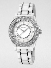 Rows of shimmering Swarovski crystals and an ultra-light white link bracelet create a timeless contrast of tradition and tech.Quartz movementWater resistant to 10 ATMStainless steel round case with white polycarbonate finish, 35mm diameter (1.38)Crystal bezelWhite dialArabic numeral 12 and crystal hour markersSecond handLightweight white polycarbonate link bracelet with stainless steel accentsImported