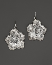 Delicate gardenias, captured at the height of their beauty in sterling silver, bloom on these earrings from Buccellati.