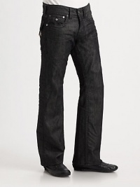 A relaxed fit with modern sensibilities, rendered with stitched flap pockets and occasional wrinkles in washed black denim. Five-pocket styleStitched flap back pocketsInseam, about 34CottonMachine washMade in USA 