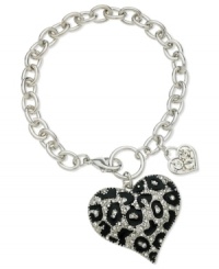 GUESS shows it has its heart in the right place with this bracelet. Crafted from silver-tone mixed metal with glass crystal stones and jet accents. Approximate length: 7-1/2 inches. Approximate drop: 1-1/2 inches. Approximate