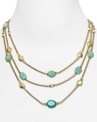 Embellished with striking turquoise beads and hammered stations, Lauren Ralph Lauren's link necklace is a striking adornment. Layer it over a crisp collar for a cool contrast.