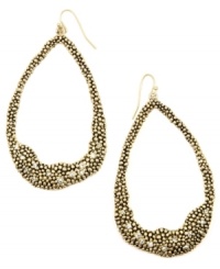 Organic inspiration. A subtle asymmetrical design makes RACHEL Rachel Roy's trendy hoop earrings a total must-have. Crafted in gold tone mixed metal with sparkling crystal accents. Approximate drop: 3-1/4 inches.