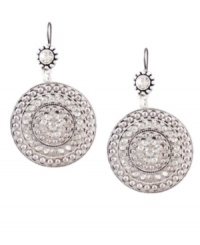 Embrace statement-making style. These bold, bohemian-style earrings by Jessica Simpson feature a large, textured disc drop in worn silver tone mixed metal. Approximate drop: 2-1/2 inches.