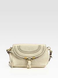 Metallic leather, crafted in a sleek flap silhouette with a versatile crossbody strap.Removable adjustable strap, 21¼-22½ dropFlap snap closureOne inside open pocketCanvas lining9¼W X 6H X 3DMade in Spain