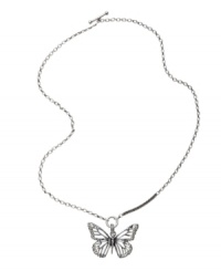 Decorate your neckline with natural style. This beautiful openwork butterfly pendant by Fossil features a silver tone mixed metal setting with clear crystal details. Necklace chain can be worn long or short. Approximate length: 16 to 32 inches. Approximate drop: 1-3/4 inches.