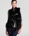 Crack the code to cool in a MICHAEL Michael Kors faux-fur vest, featuring plush texture and toggle closures for a touch of utilitarian chic.