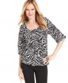 MICHAEL Michael Kors' petite top features a stylish zebra print and billowy blouson-style fit. Perfect for pairing with skirts, pants, jeans and more!