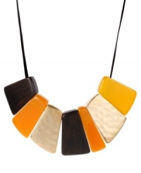 Pick a new palette for the season! This chic Kenneth Cole New York frontal necklace is composed of geometric gold-tone mixed metal discs with brown, yellow and orange beads. Sits on a brown leather cord. Approximate length: 17 inches + 3-inch extender. Approximate drop: 2 inches.