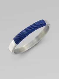 A modern, square-edged bangle of brushed aluminum, with a colorfully wrapped rich leather cord.LeatherAluminumDiameter, about 2¾Imported