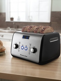 A four-slice, one-touch motorized lift control toaster features an LCD display with a digital progress bar and extra-wide 1.5 slots that accept the thickest bagels, breads or pastries.Please note: for use with US power sockets onlyDurable temperature knob with light/dark indicatorAll-metal constructionRemovable crumb trayLCD display with digital progress barKeep Warm, Bagel, Defrost, Reheat, and Toast/Cancel buttonsImported 