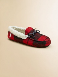 A classic slip-on slipper lined in plush faux shearling with a preppy woven plaid design.Slip-onWool upperFaux shearling liningRubber solePadded insoleImported