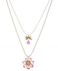 Time for a little romance. Betsey Johnson's sweet, two-row pendant necklace features a blue and pink crystal-encrusted flower and a petite ribbon charm. Crafted in antique gold-plated mixed metal. Approximate length: 16 inches + 3-inch extender. Approximate drop: 2-3/4 inches.